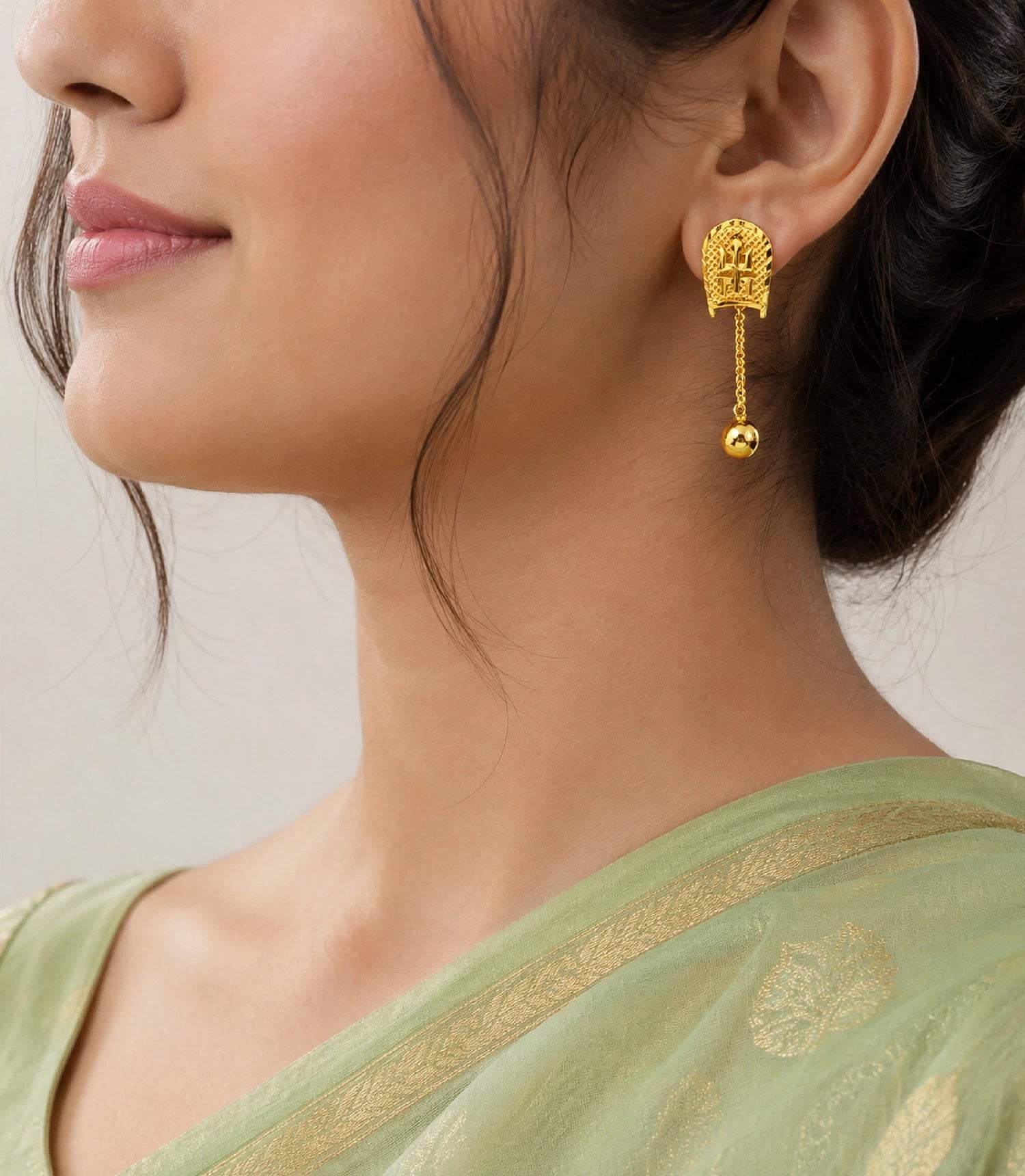 Model Wearing Gold Plated Swastik Shield Hanging Ball Drop Earrings DBC1494
