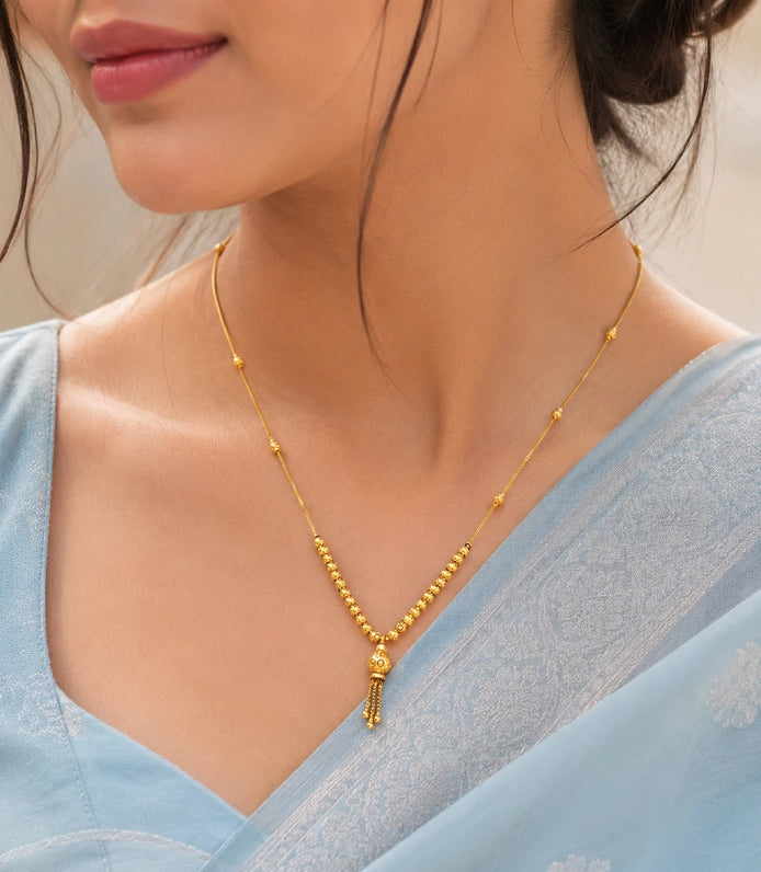 Model Wearing Gold Plated Light Beaded Chain Necklace DCN5673